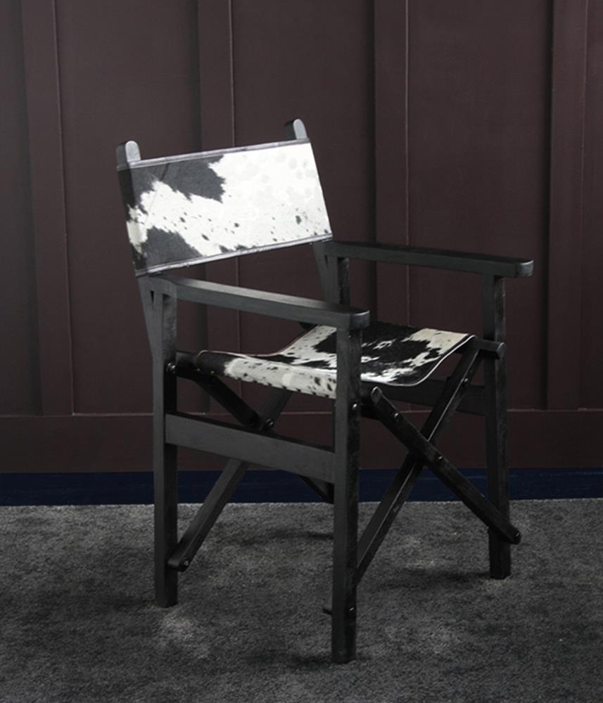 Black and white cowhide wooden folding director's chair by Where Saints Go
